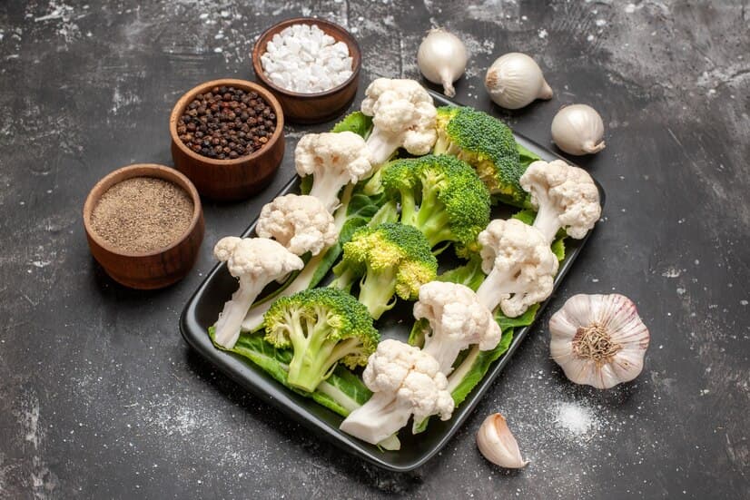 Broccoli and Cauliflower on Black Plate and Spices