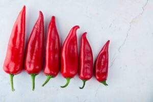 Close-up of red pepper on white background