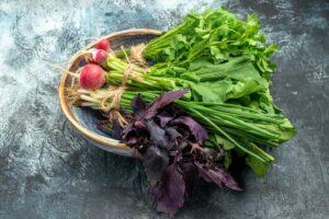 Fresh Greens with Radish on Dark-Light Background